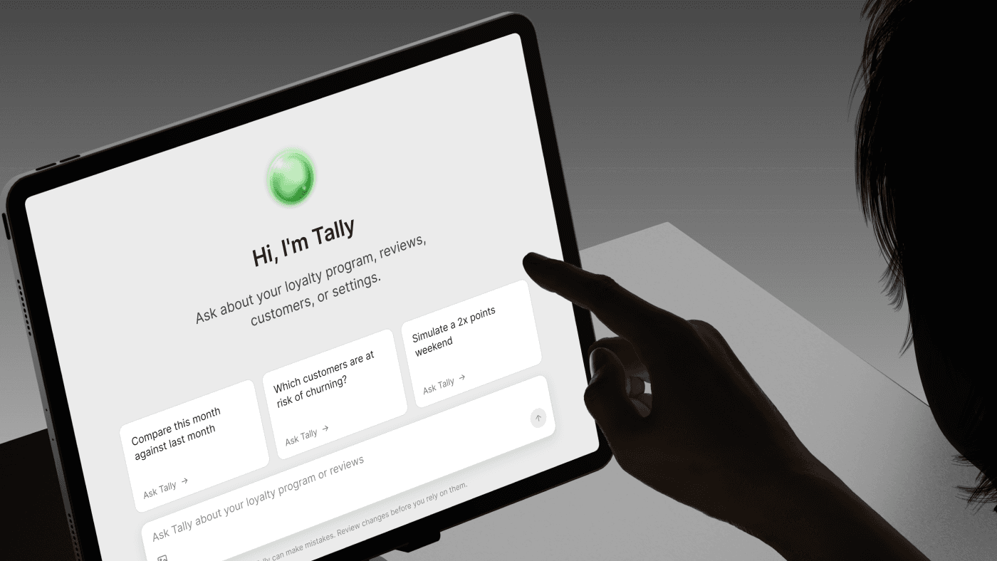 Tally AI assistant answering questions on a tablet inside PerkStack